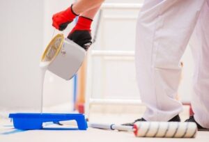 Homeowner reviewing qualifications and estimates to hire reliable and skilled house painters