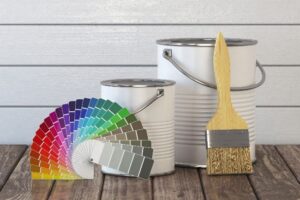 Homeowner reviewing paint options to select the best interior and exterior paint for a residential property