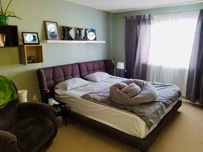 Sage green and purple painted bedroom with calm relaxing colour palette