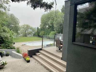 Dark stucco exterior paint with poolside patio and modern architecture