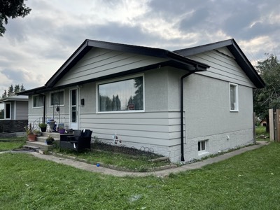 Grey and white painted bungalow exterior with clean modern curb appeal