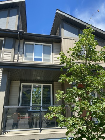 Modern townhouse exterior with fresh paint in contemporary colour palette