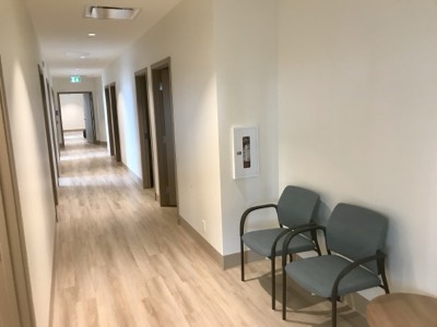 Modern commercial hallway with fresh professional paint finish and clean lines
