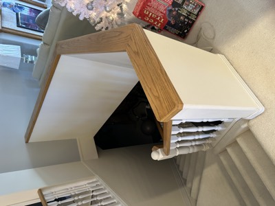 Cream painted stair railing with oak cap and smooth baluster finish