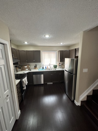 Charcoal painted compact kitchen with efficient layout and modern finishes
