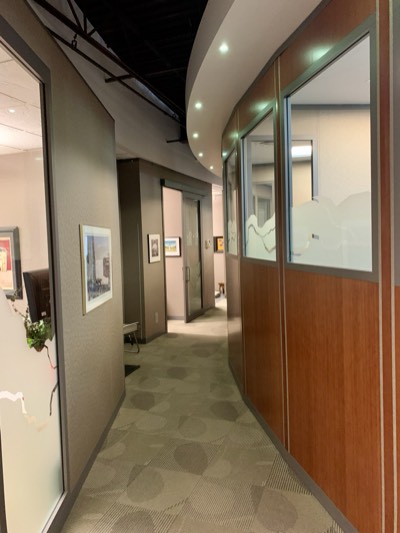 Dental office hallway with wood trim and complementary painted wall colours