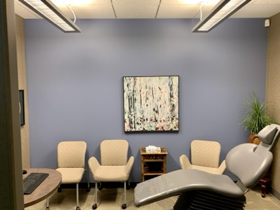 Dental office hallway with soft lavender painted walls and welcoming ambiance