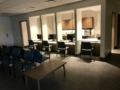 Medical clinic waiting room with warm painted walls and comfortable seating