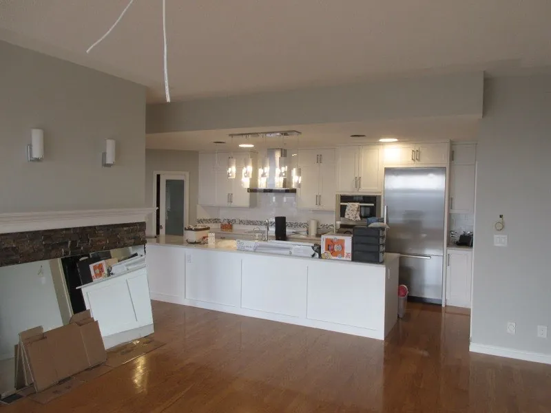 Kitchen cabinet refacing by iPaint Painting — modern white cabinets in Edmonton home