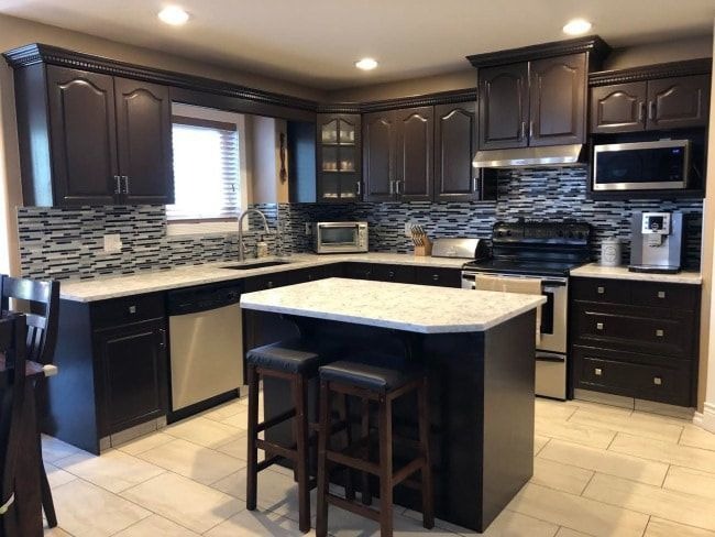 Kitchen interior featuring well-coordinated wall and cabinet colours that enhance brightness and visual harmony