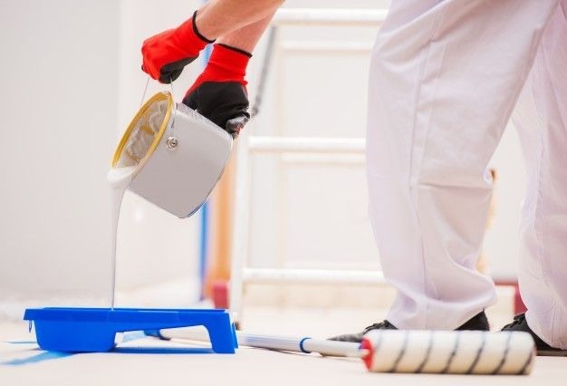 Homeowner reviewing qualifications and estimates to hire reliable and skilled house painters