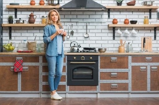 Freshly repainted kitchen cabinets showing a renewed look without the cost of a full renovation