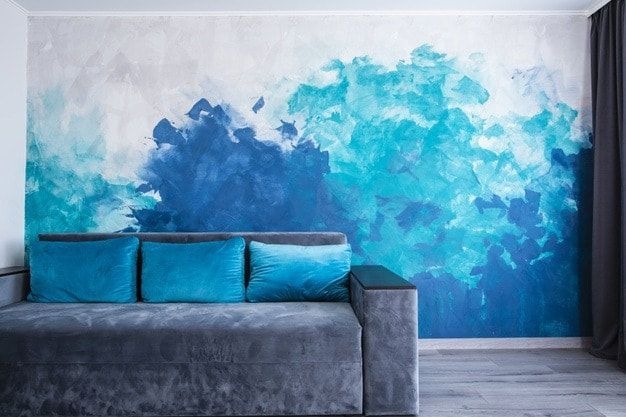 Professional residential painting contractor working on an Edmonton home interior with high-quality tools and materials