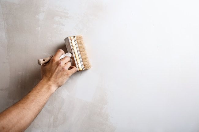 Commercial paint contractors performing professional interior and exterior painting on a business property